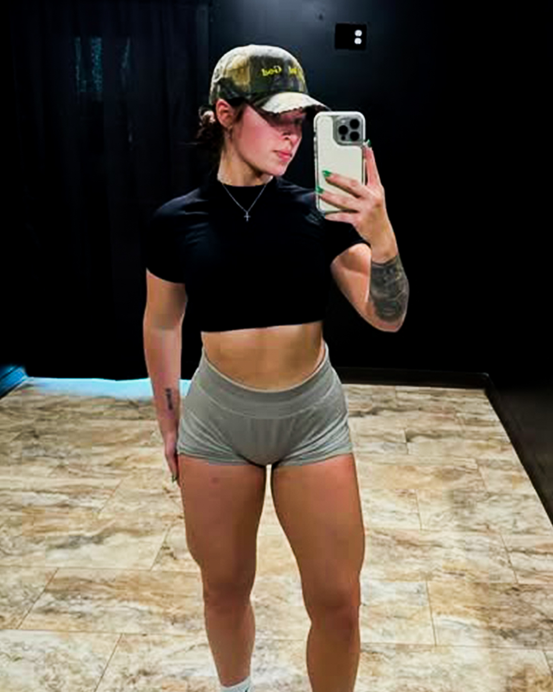 Emily, a two-time ultra marathon runner, racing outdoors during an ultra marathon, showcasing her endurance and focus.